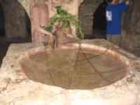 Water fountain with stone basin