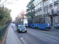 Several blue streetcars in street