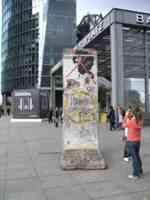 Segment of Berlin Wall in a city plaza